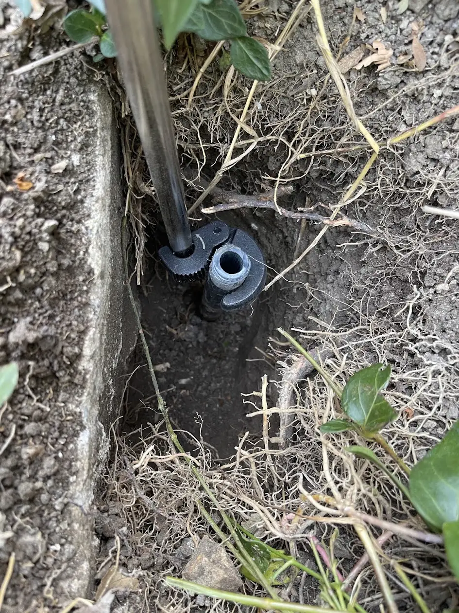 Snapped-off sprinkler riser dug out for repair at a Calabasas home