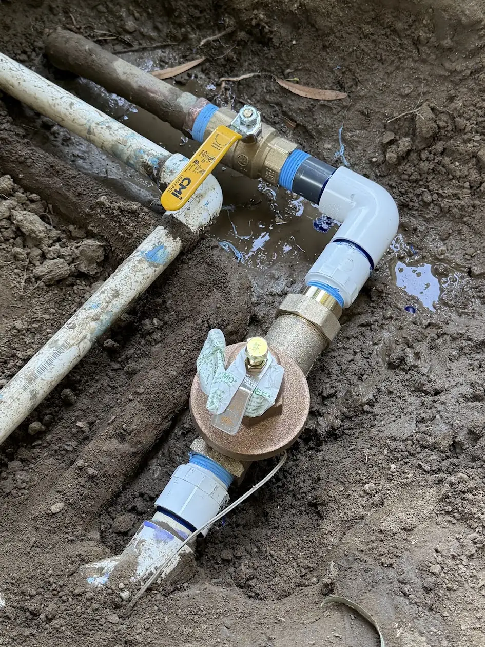 New sprinkler shut-off valve and pressure regulator installed on the irrigation main line