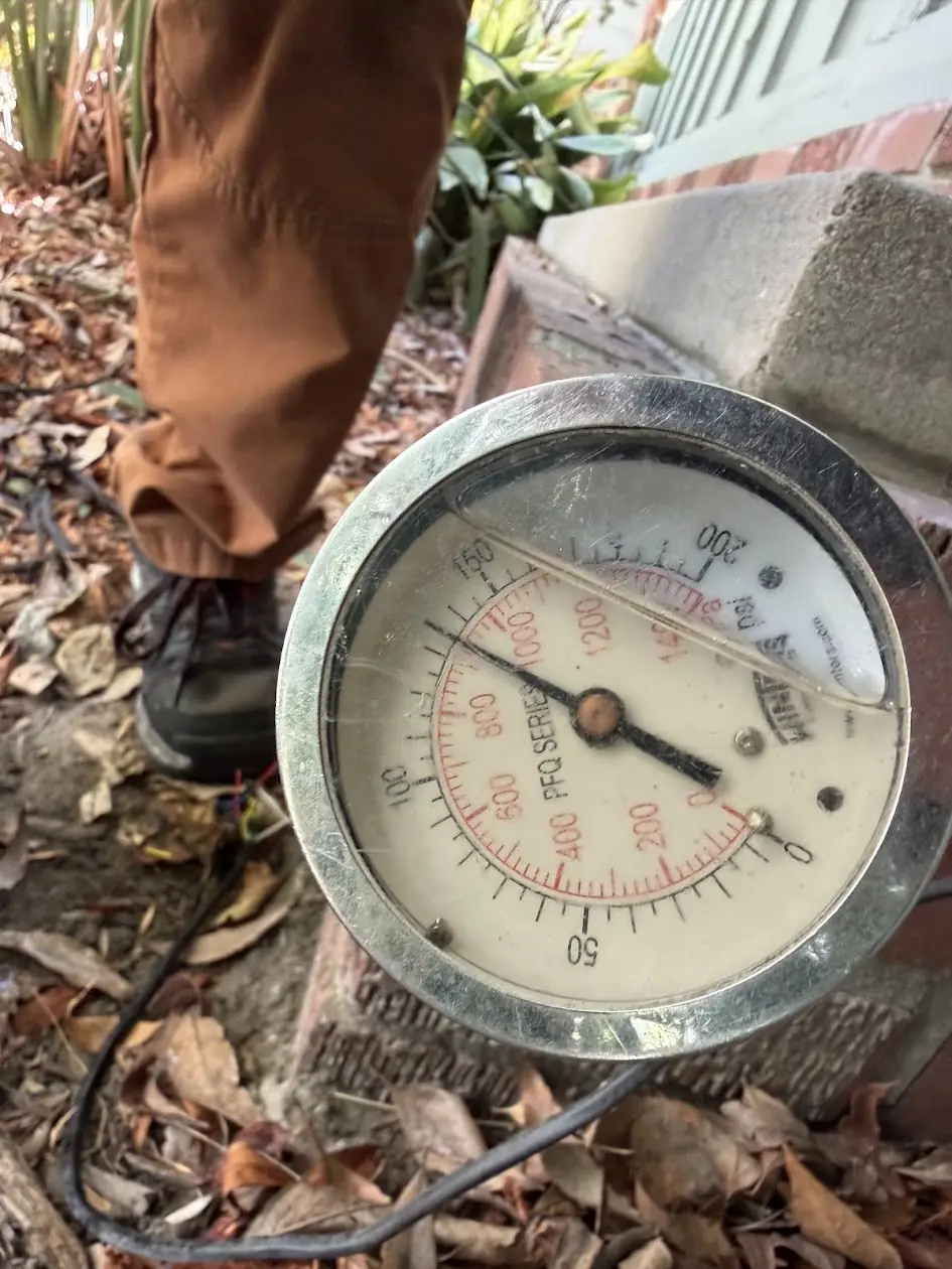 Water pressure gauge testing a sprinkler line